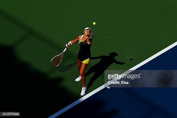 Nadia Petrova of Russia serves to Lucie Safarova of the Czech Republic during their women's singles third round match on Day Five of the 2012 US Open...