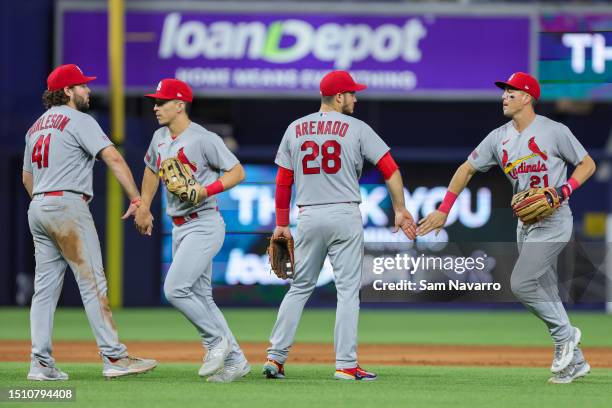 Alec Burleson, Tommy Edman, Nolan Arenado and Lars Nootbaar of the St. Louis Cardinals celebrate a 3-0 win against the Miami Marlins at loanDepot...