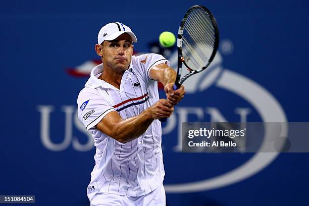 Andy Roddick of the United States returns a shot during his men's singles second round match against Bernard Tomic of Australia on Day Five of the...