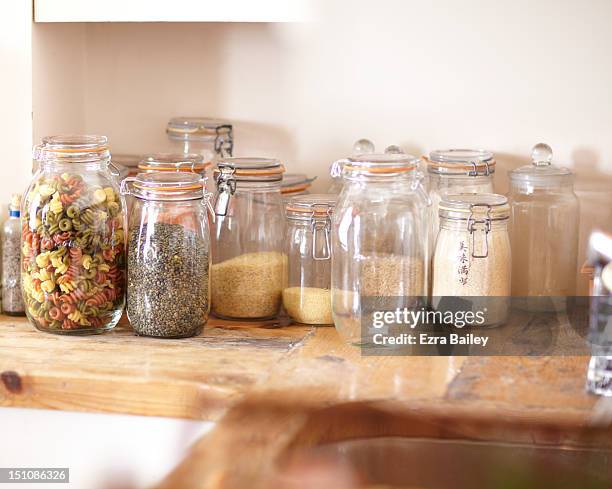 jars filled with ingredients - jars kitchen stock pictures, royalty-free photos & images