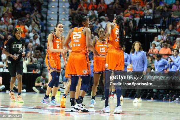 Connecticut Sun players react after forcing Seattle Storm to call timeout during a WNBA game between Seattle Storm and Connecticut Sun on July 6 at...