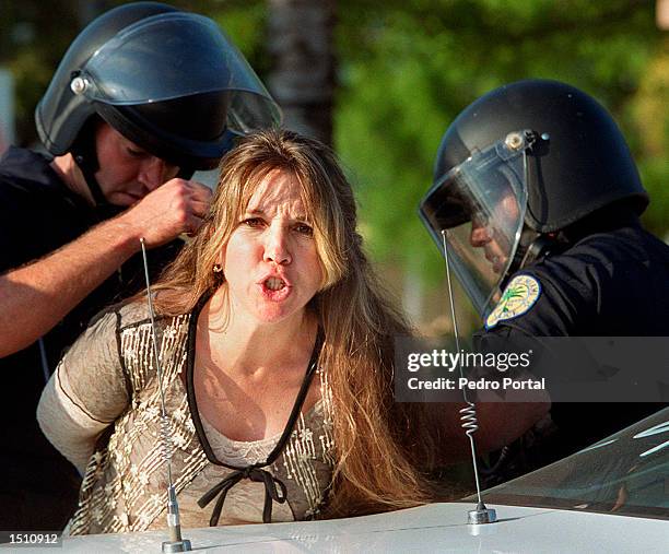 Miami Edison Riot A woman is arrested April 22, 2000 during a protest after news of ...