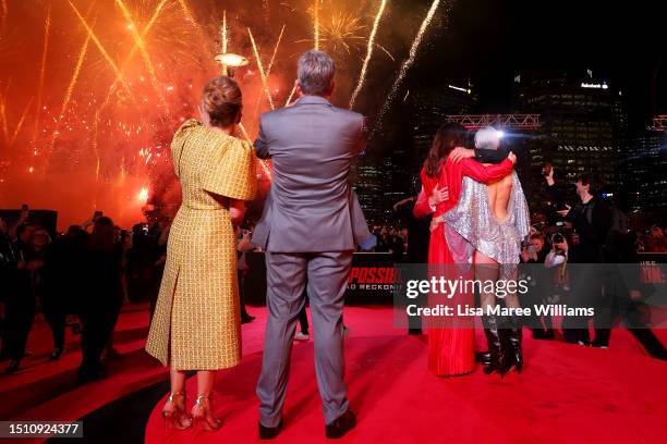 Christopher McQuarrie, Heather McQuarrie, Hayley Atwell, Simon Pegg, Pom Klementieff and Tom Cruise look out across Darling Harbour during the...