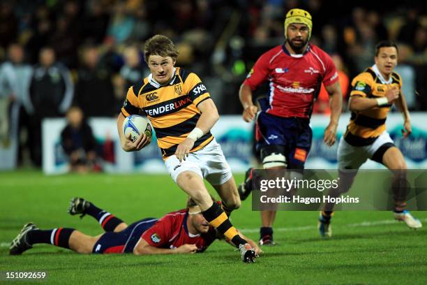 Beauden Barrett of Taranaki makes a break during the round three ITM Cup match between Taranaki and Tasman at Yarrow Stadium on September 1, 2012 in...