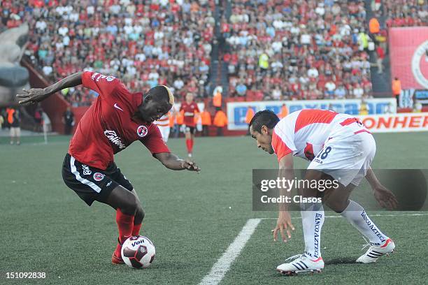 Duvier Riascos of Tijuana struggle for the ball with Luis Esqueda of Jaguares during a match between Tijuana and Jaguares as part of the Apertura...