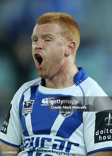 Kris Keating of the Bulldogs celebrates scoring a try during the round 26 NRL match between the Canterbury Bulldogs and the Sydney Roosters at ANZ...