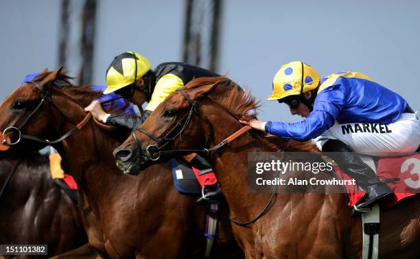 William Buick riding Fantastic Moon win The Candy Kittens Solario Stakes at Sandown racecourse on September 01, 2012 in Esher, England.