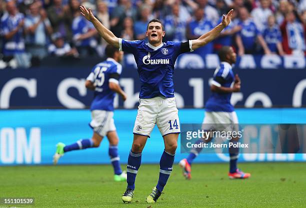 Kyriakos Papadopoulos of Schlake celebrates after scoring his tem's first goal during the Bundesliga match between FC Schalke 04 and FC Augsburg at...