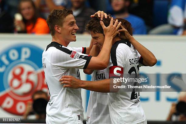 Pirmin Schwegler of Frankfurt celebrates his goal with his teammate Bastian Oczipka during the Bundesliga match between 1899 Hoffenheim and Eintracht...