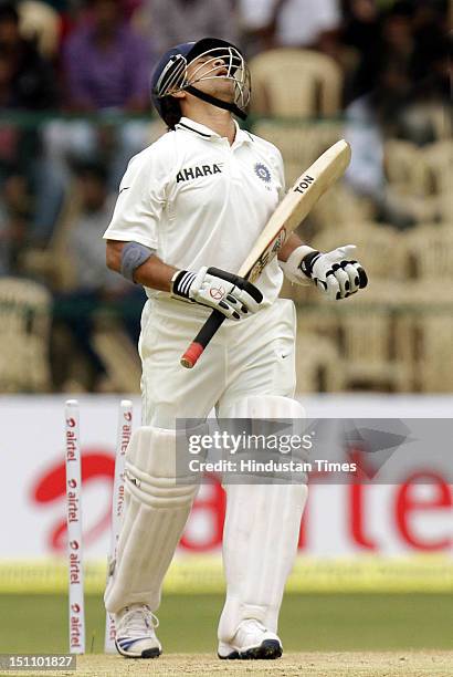 Indian batsman Sachin Tendulkar is bowled by New Zealand bowler Doug Bracewell during the second test cricket match at M Chinnaswamy stadium on...