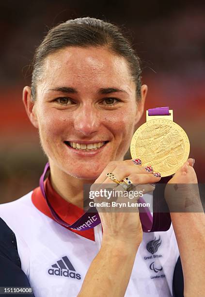 Gold medalist Sarah Storey of Great Britain poses on the podium during the medal ceremony for the Women's Individual C4-5 500m Time Trial on day 3 of...