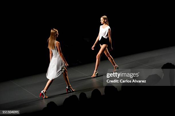 Models walk the runway in the AA de Amaya Arzuaga fashion show during the Cibeles Madrid Fashion Week Spring/Summer 2013 at Ifema on September 1,...