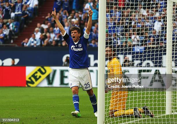 Klaas-Jan Huntelaar of Schalke celebrates after scoring his team's third goal during the Bundesliga match between FC Schalke 04 and FC Augsburg at...