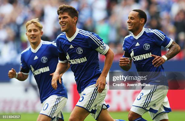 Klaas-Jan Huntelaar of Schalke celebrates with his team mates after scoring his team's third goal during the Bundesliga match between FC Schalke 04...