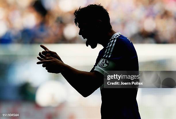 Klaas-Jan Huntelaar of Schalke celebrates after scoring his team's third goal during the Bundesliga match between FC Schalke 04 and FC Augsburg at...