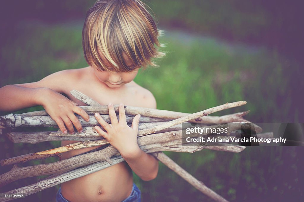 Boy with sticks