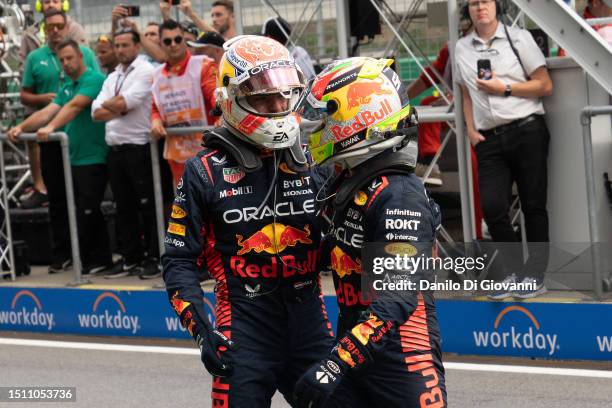 Max Verstappen of Netherlands and Red Bull Racing and Sergio Perez of Mexico and Red Bull Racing during the F1 Grand Prix of Austria at Red Bull Ring...
