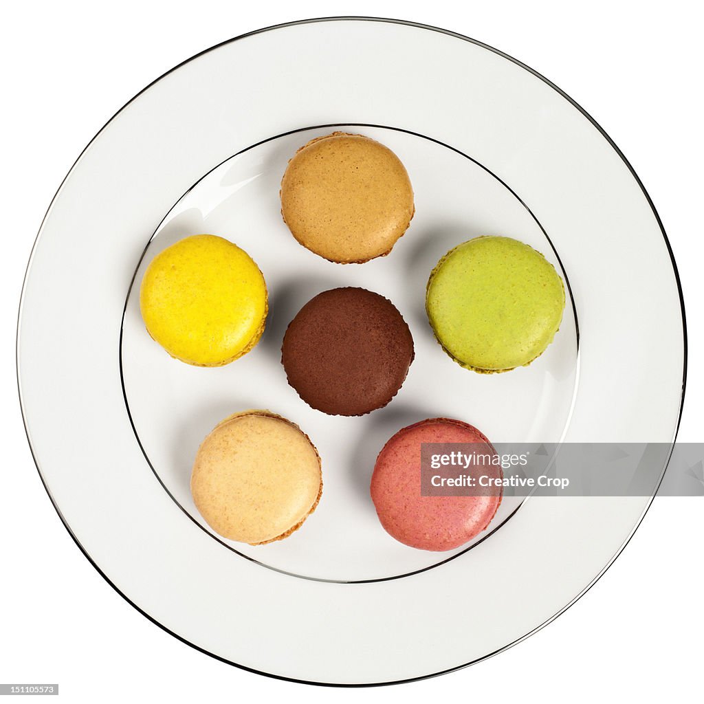 Selection of six macaroons on a white plate