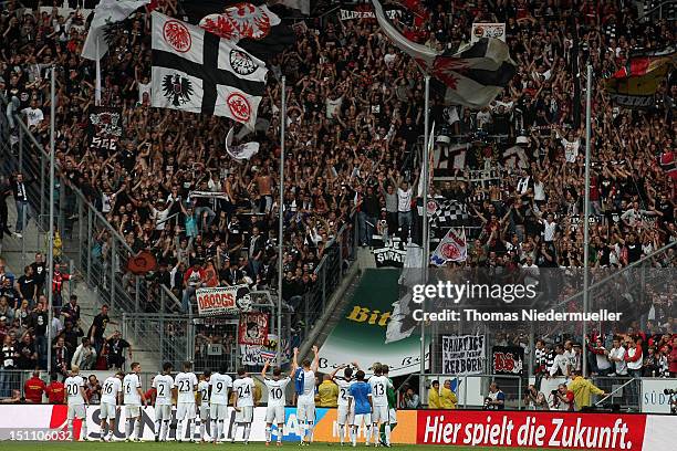 The team of Frankfurt celebrates with the crowd after the Bundesliga match between 1899 Hoffenheim and Eintracht Frankfurt at Rhein-Neckar-Arena on...