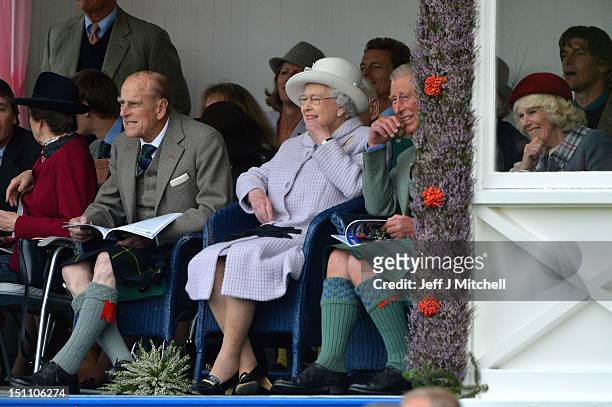 Prince Philip, Duke of Edinburgh, Queen Elizabeth II and Prince Charles, Prince of Wales attend the Braemar Highland Games at The Princess Royal and...