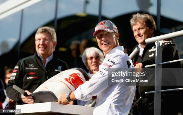 Michael Schumacher of Germany and Mercedes GP is seen with F1 supremo Bernie Ecclestone, Mercedes GP Team Principal Ross Brawn and Mercedes...