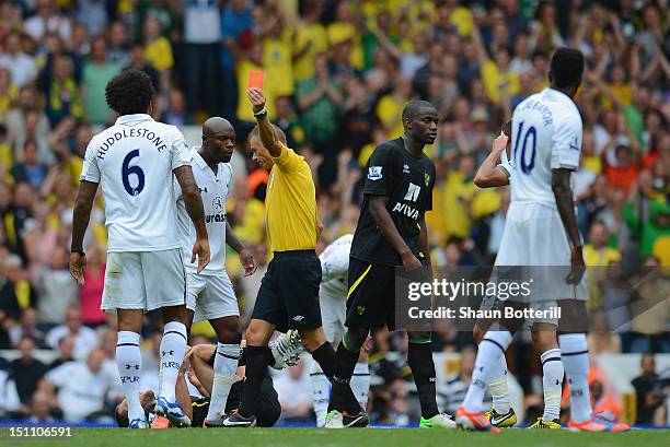 Tom Huddlestone of Tottenham Hotpsur is sent off by referee Mark Halsey during the Barclays Premier League match between Tottenham Hotspur and...