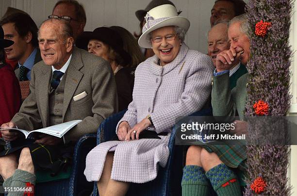 Prince Philip, Duke of Edinburgh, Queen Elizabeth II and Prince Charles attend the Braemar Highland Games at The Princess Royal and Duke of Fife...