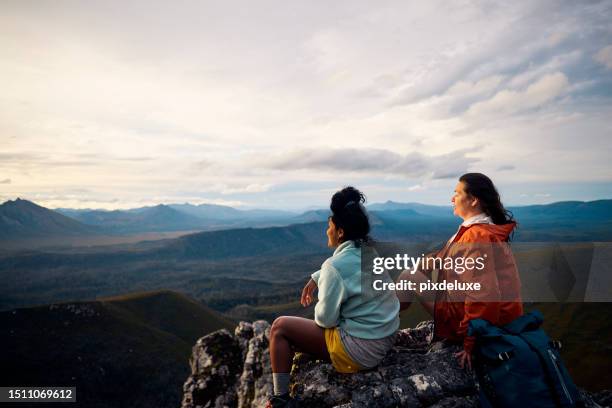 women hikers embracing the untamed beauty of tasmania through exhilarating bushwalking. - climbing stock pictures, royalty-free photos & images