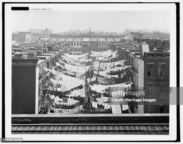 Yard of tenement at Park Ave. And 107th St., New York, circa 1900. Creator: Unknown.