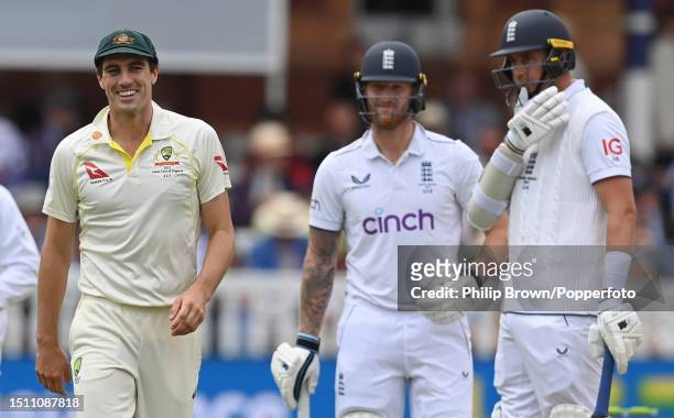 Ben Stokes and Stuart Broad of England watch Pat Cummins of Australia during the fifth day of the 2nd Test between England and Australia at Lord's...