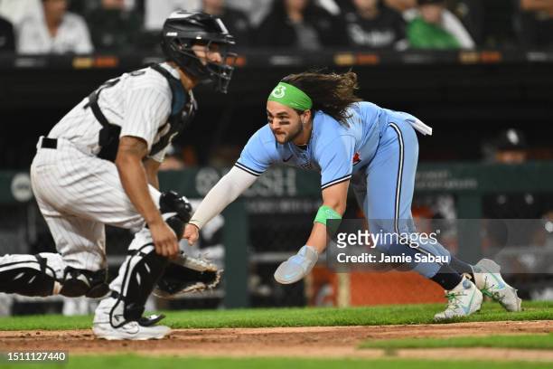 Bo Bichette of the Toronto Blue Jays scores on a double off the bat of Vladimir Guerrero Jr. 1in the seventh inning of game two of a double-header...