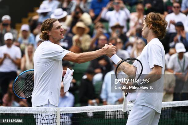 Max Purcell of Australia congratulates Andrey Rublev following their Men's Singles first round match during day one of The Championships Wimbledon...