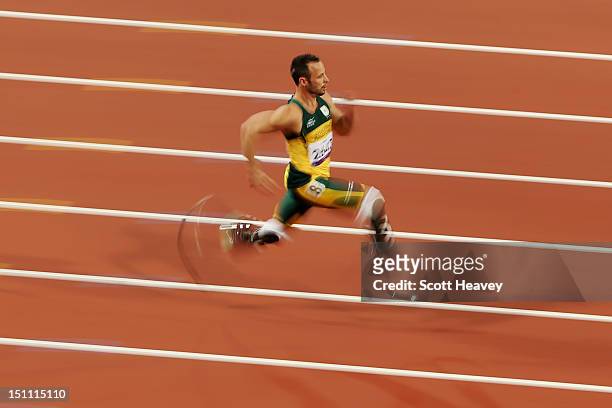Oscar Pistorius of South Africa breaks the world record with a time of 21.30 as he competes in the Men's 200m - T44 heats on day 3 of the London 2012...