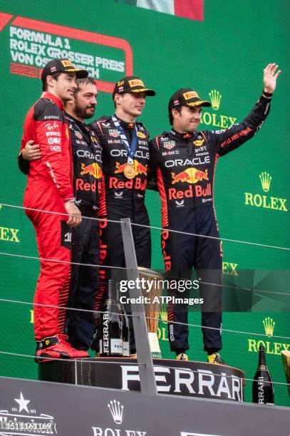 Max Verstappen of the Netherlands driving the Oracle Red Bull Racing RB19 and Sergio Perez of Mexico driving the Oracle Red Bull Racing RB19, Charles...