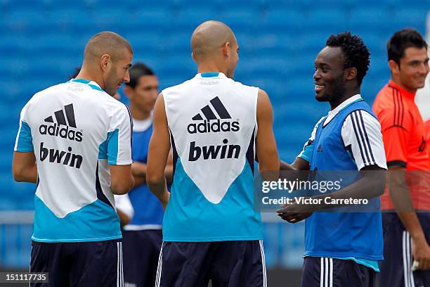 Michael Essien with Pepe during a Real Madrid training session at Estadio Santiago Bernabeu after he signs a season-long loan with Real Madrid on...