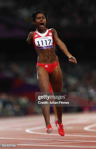 Yunidis Castillo of Cuba celebrates as she crosses the line to win gold in the Women's 200m - T46 Final on day 3 of the London 2012 Paralympic Games...