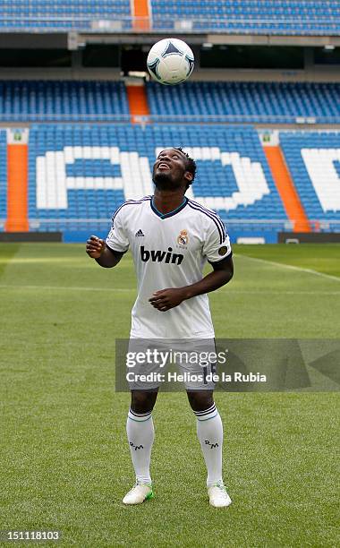 Michael Essien poses as he signs a season-long loan with Real Madrid at Santiago Bernabeu stadium on September 1, 2012 in Madrid, Spain.