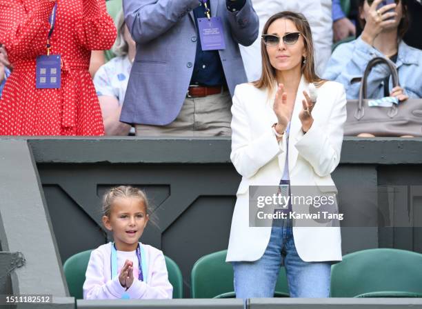 Jelena Djokovic claps during Pedro Cachín V Novak Djokovic on day one of the Wimbledon Tennis Championships at the All England Lawn Tennis and...