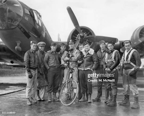 American pilot Robert W Biesecker and his crew standing by their B-17 Flying Fortress bomber 'Honey Chile' at a US Eighth Air Force station in...