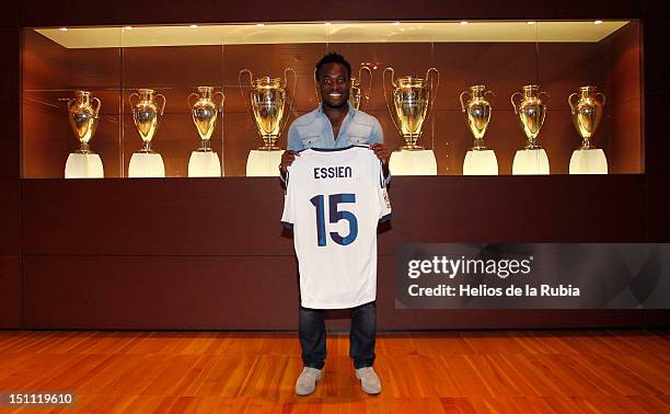 Michael Essien poses with a Real Madrid shirt before he signs a season-long loan with Real Madrid on September 1, 2012 in Madrid, Spain.