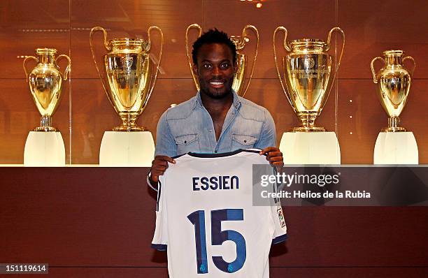 Michael Essien poses with a Real Madrid shirt before he signs a season-long loan with Real Madrid on September 1, 2012 in Madrid, Spain.