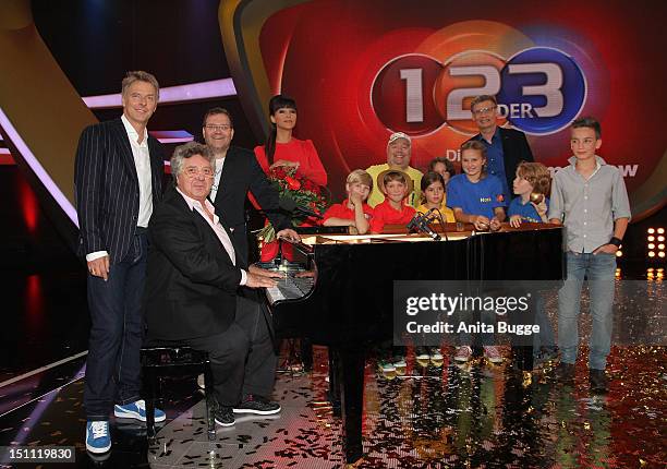 Joerg Pilawa, Michael Schanze, Elton, Verona Pooth, Dirk Bach and Guenther Jauch attend a photocall for '1, 2 oder 3 - Die Grosse Jubilaeumsshow' at...