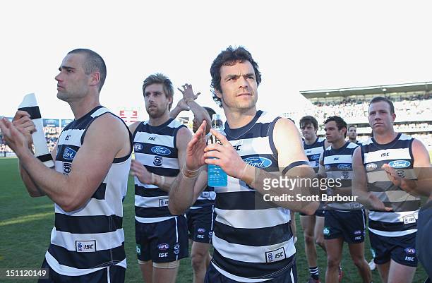 Matthew Scarlett of the Cats leaves the field after winning the round 23 AFL match between the Geelong Cats and the Sydney Swans at Simonds Stadium...