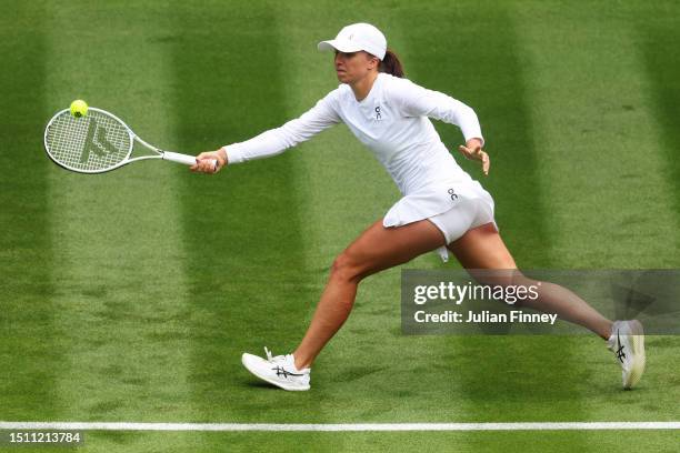 Iga Swiatek of Poland plays a forehand against Lin Zhu of People's Republic of China in the Women's Singles first round match during day one of The...