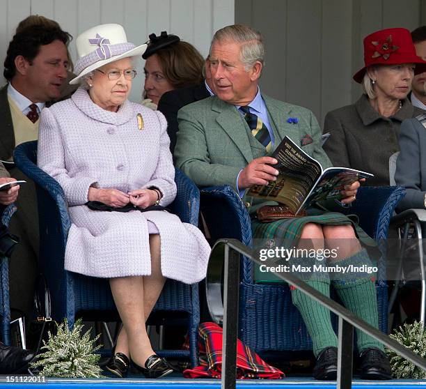 Queen Elizabeth II and Prince Charles, Prince of Wales attend the 2012 Braemar Highland Gathering at The Princess Royal & Duke of Fife Memorial Park...