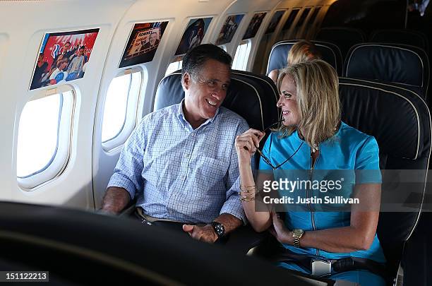 Republican presidential candidate, former Massachusetts Gov. Mitt Romney and his wife Ann Romney talk on the campaign plane on September 1, 2012 en...