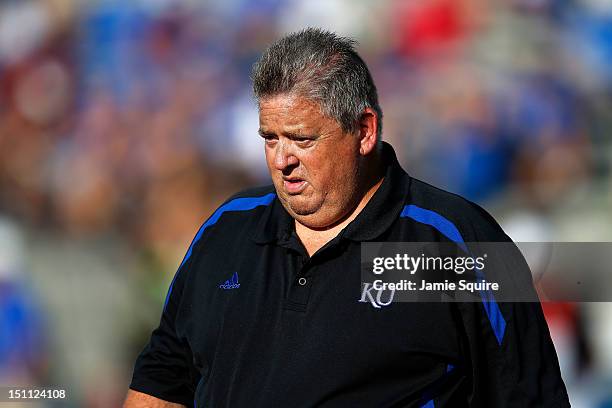 Head coach Charlie Weis of the Kansas Jayhawks watches during player warm-ups prior to the start of the game against the South Dakota State...