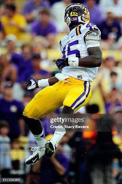 Deion Jones of the LSU Tigers celebrates a tackle behind the line during a game against the North Texas Mean Green at Tiger Stadium on September 1,...