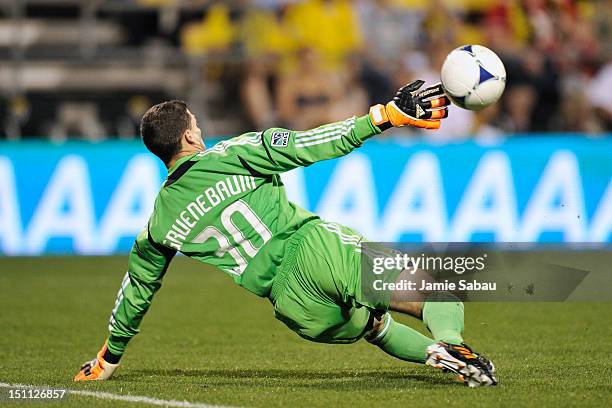 Goalkeeper Andy Gruenebaum of the Columbus Crew is unable to stop a shot from Marco Di Vaio of the Montreal Impact in the second half for Montreal's...