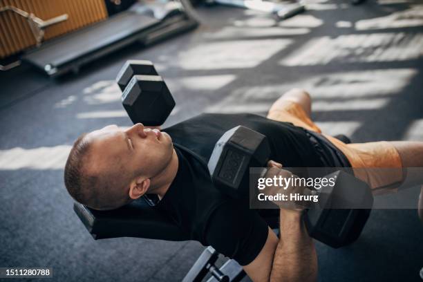 weightlifting training - weight bench stock pictures, royalty-free photos & images